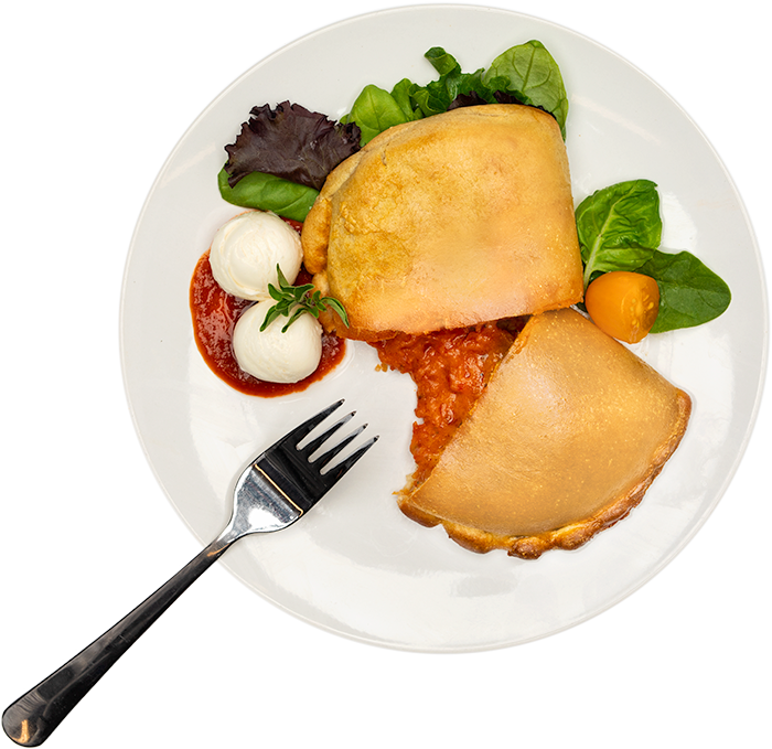 Image of the Pepperoni 5oz calzone product on a plate, with other assorted foods