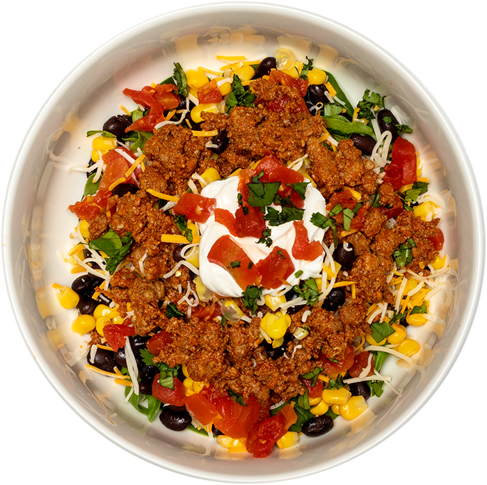 Image of the Chipotle Beef Crumble product on a plate, with other assorted foods